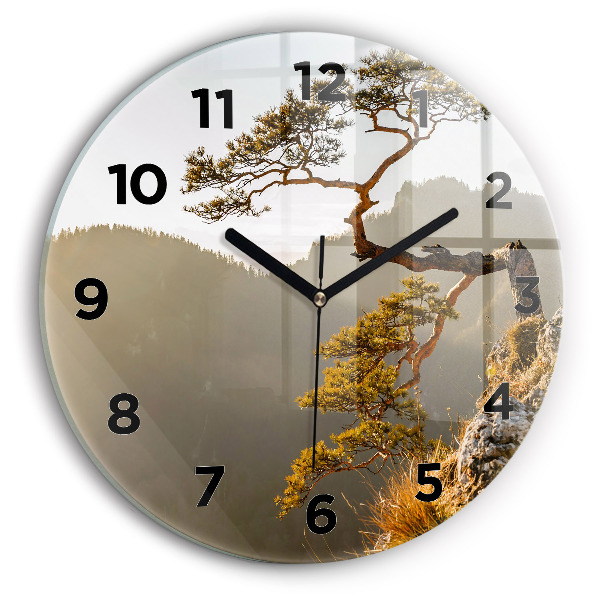 Round glass wall clock A tree in the mountains