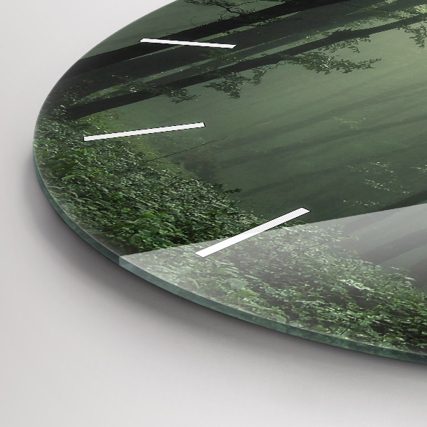 Round glass wall clock Misty forest in the morning