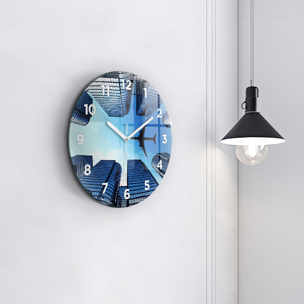 Round glass wall clock Airplane over buildings