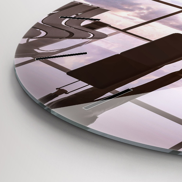 Round glass wall clock Man at the airport