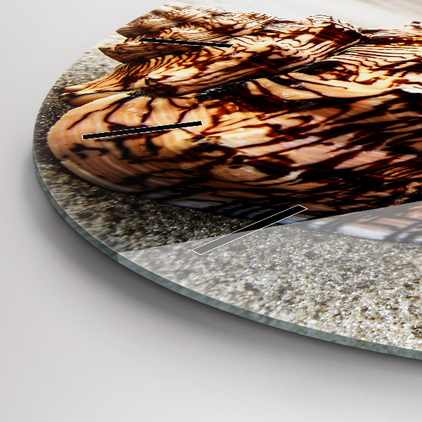 Round glass wall clock A shell on the beach