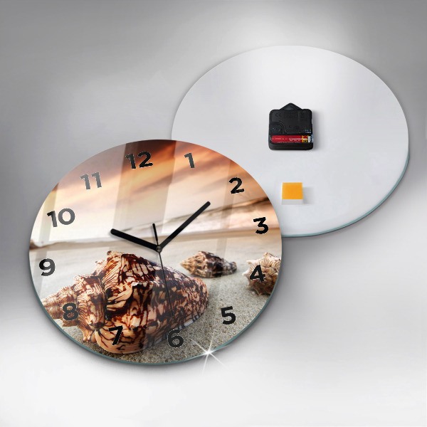 Round glass wall clock A shell on the beach