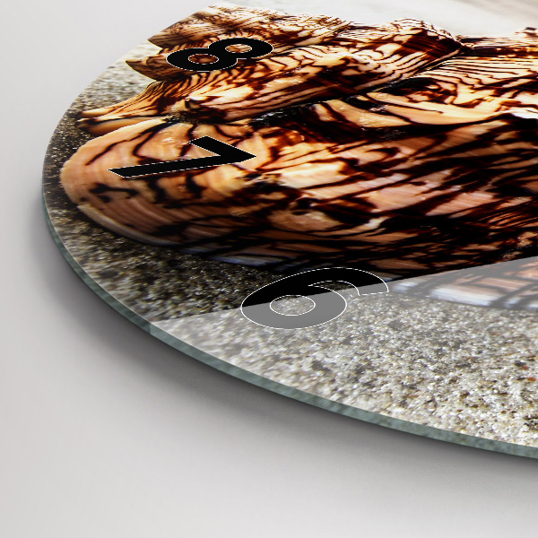 Round glass wall clock A shell on the beach