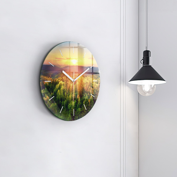 Round glass wall clock Sunset over the hills