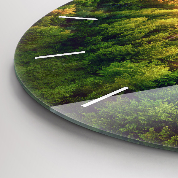 Round glass wall clock Sunset over the hills