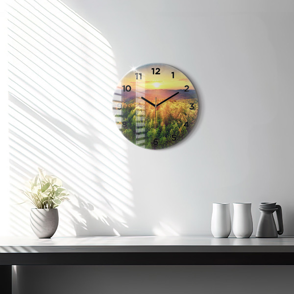 Round glass wall clock Sunset over the hills