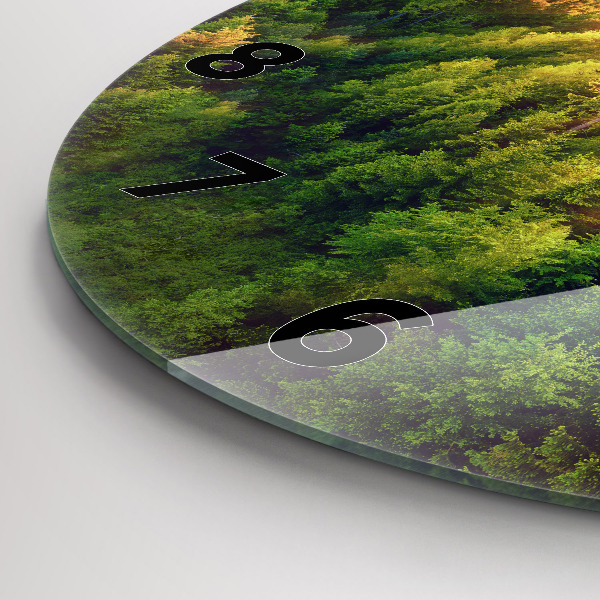 Round glass wall clock Sunset over the hills