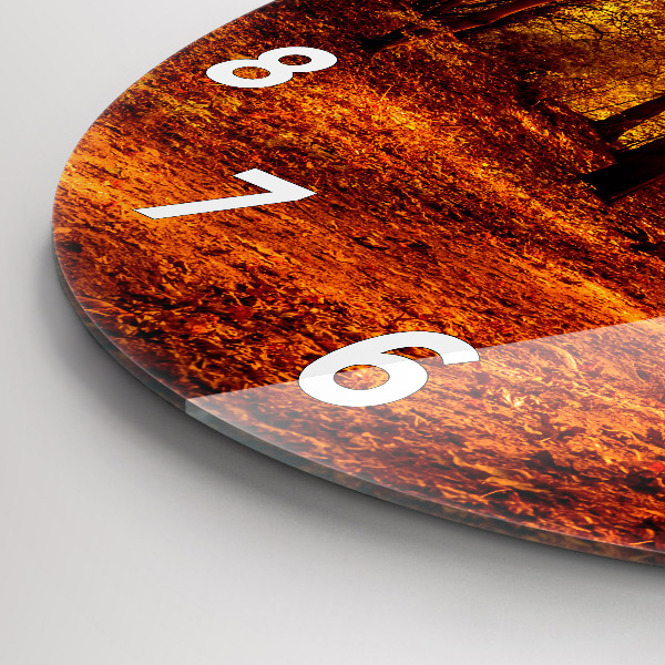 Round glass wall clock Forest landscape in the sun