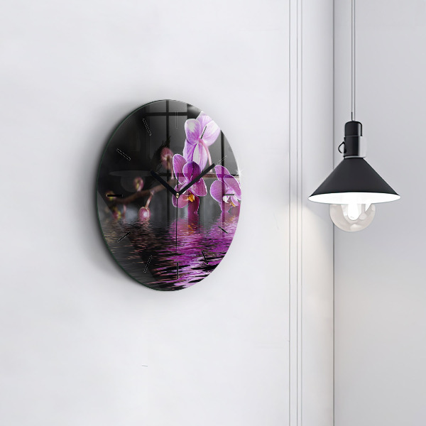 Round glass wall clock Orchid flower on the water