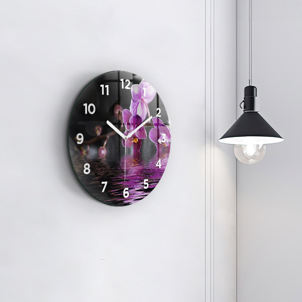 Round glass wall clock Orchid flower on the water