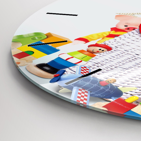 Round glass wall clock Wicker basket with toys