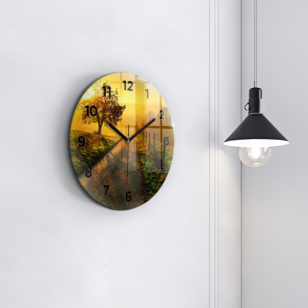 Round glass wall clock Fog at sunrise