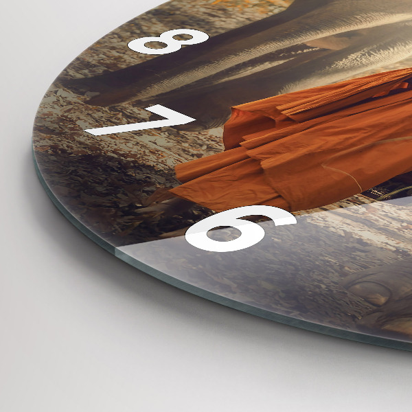 Round glass wall clock Monk leading elephants