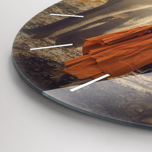 Round glass wall clock Monk leading elephants