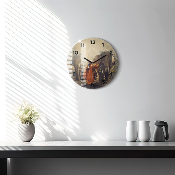 Round glass wall clock Monk leading elephants