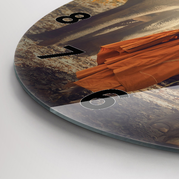 Round glass wall clock Monk leading elephants