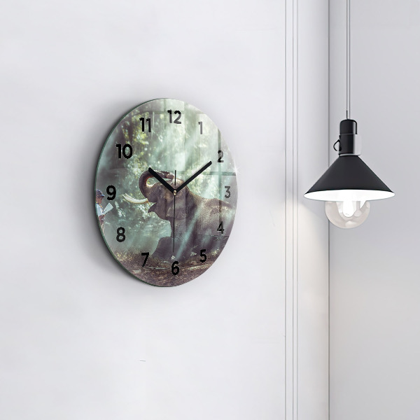 Round glass wall clock A boy is reading a book