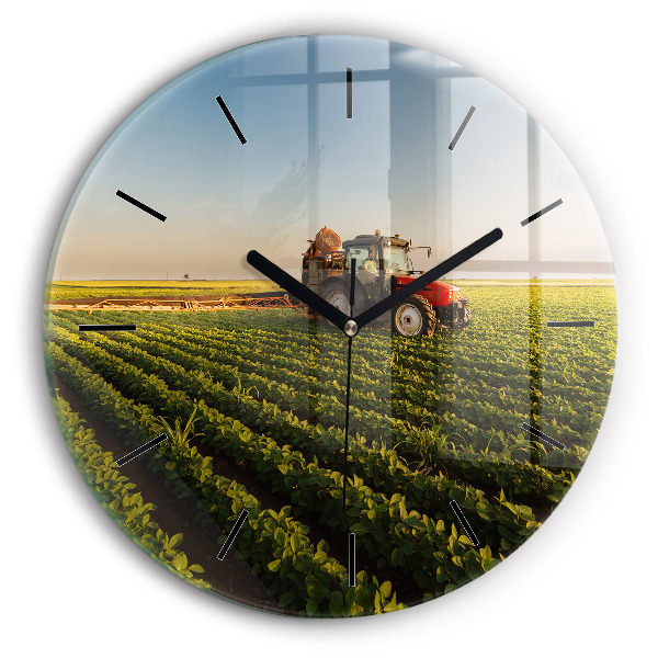 Round glass wall clock Tractor in a farm field