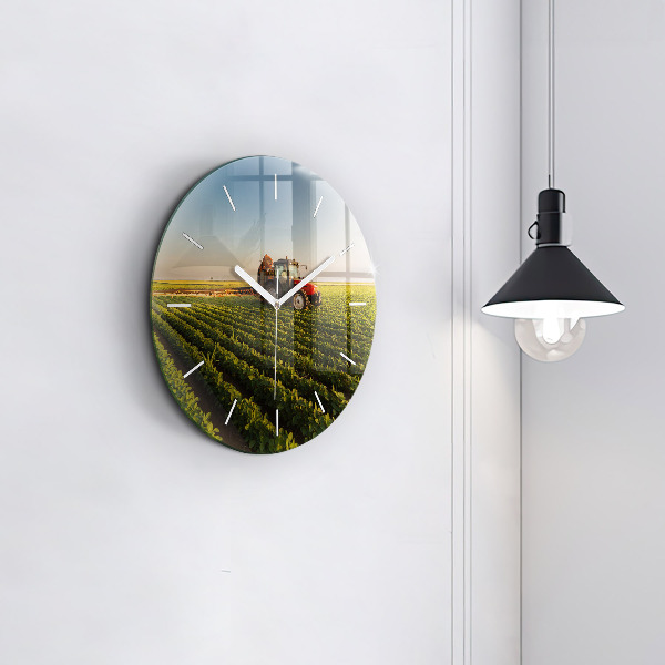 Round glass wall clock Tractor in a farm field