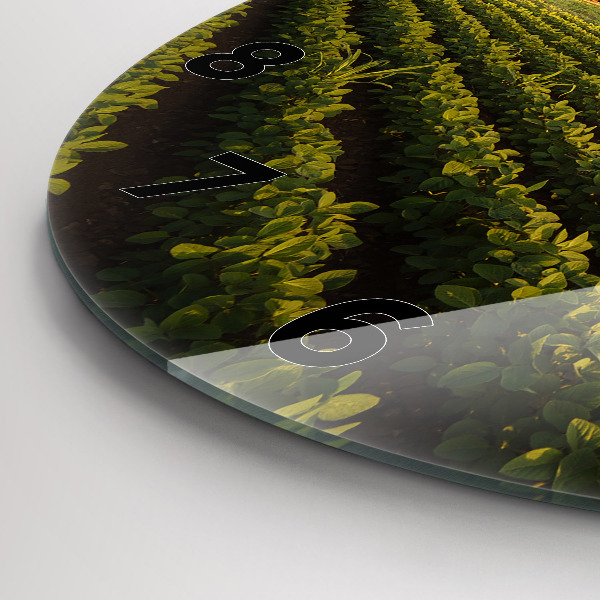 Round glass wall clock Tractor in a farm field