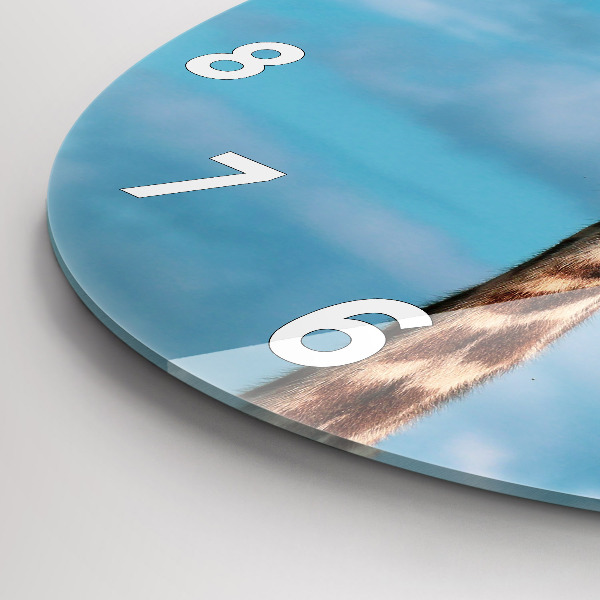 Round glass wall clock Giraffe head against the sky