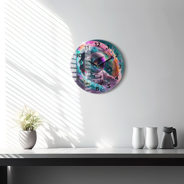 Round glass wall clock Cosmonaut and colorful clouds