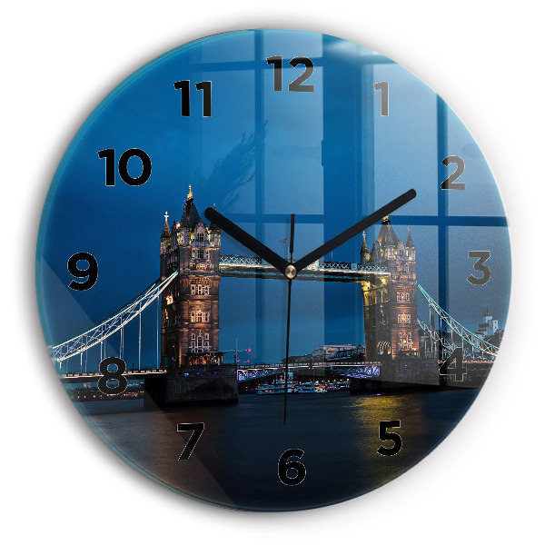 Round glass wall clock Tower Bridge London at night