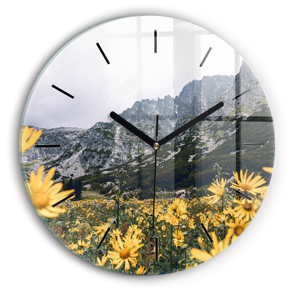 Round glass wall clock Meadow flowers in the mountains
