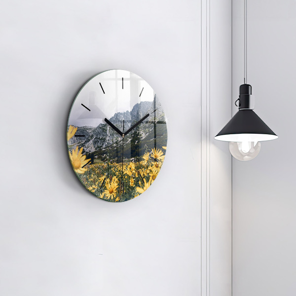 Round glass wall clock Meadow flowers in the mountains