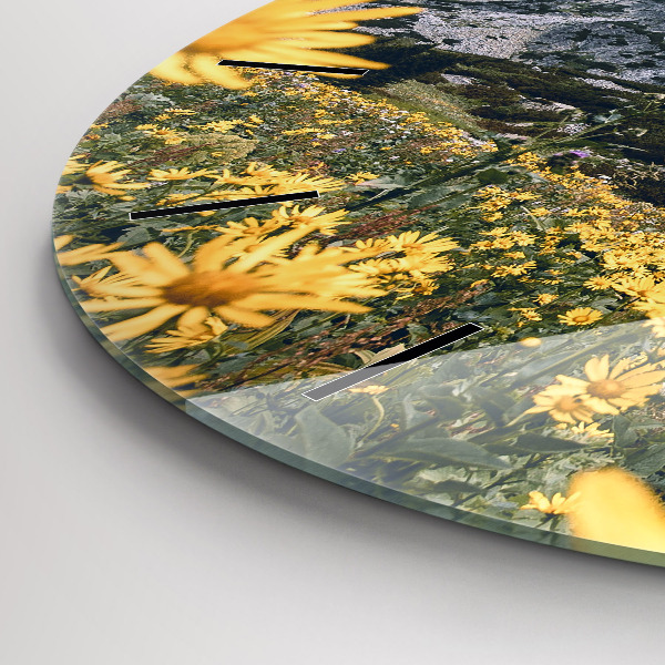 Round glass wall clock Meadow flowers in the mountains