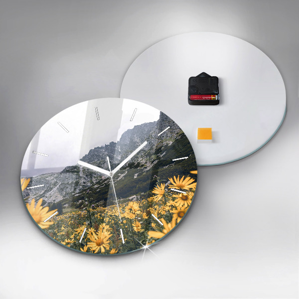 Round glass wall clock Meadow flowers in the mountains