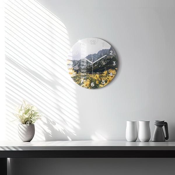 Round glass wall clock Meadow flowers in the mountains