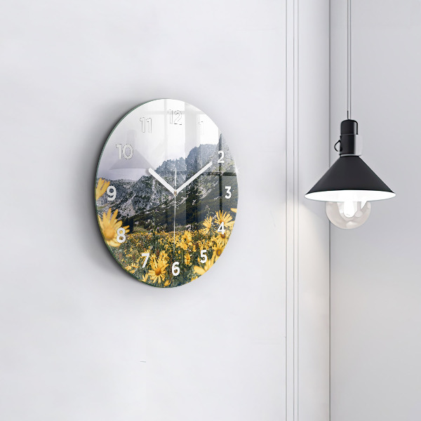 Round glass wall clock Meadow flowers in the mountains