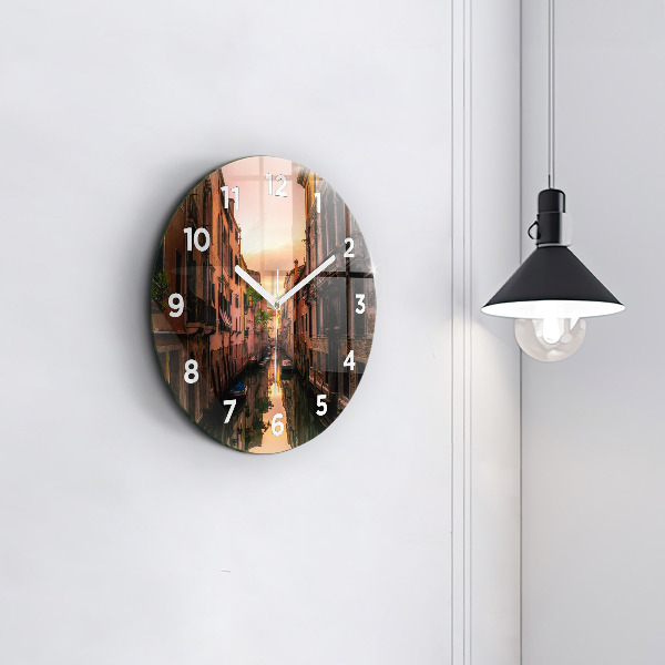 Round glass wall clock View of the canal in the city