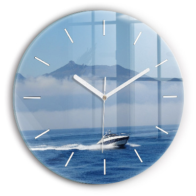 Round glass wall clock A boat floating on the ocean