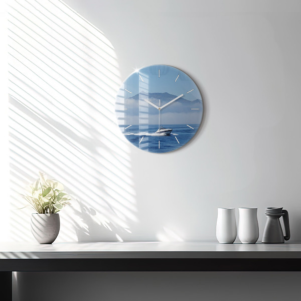 Round glass wall clock A boat floating on the ocean