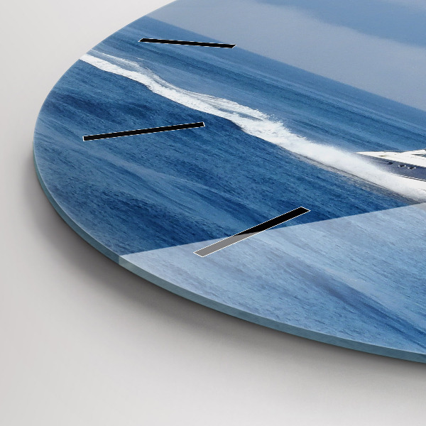 Round glass wall clock A boat floating on the ocean