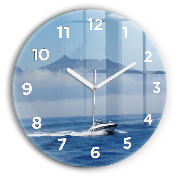 Round glass wall clock A boat floating on the ocean