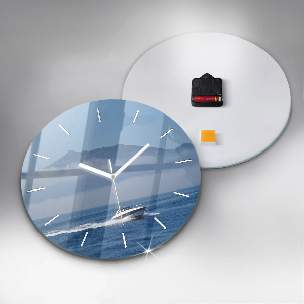 Round glass wall clock A boat floating on the ocean