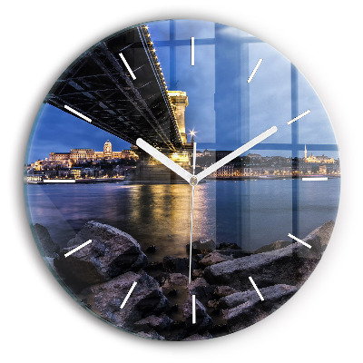 Round glass wall clock Rocky shore under the bridge