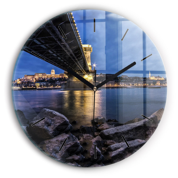 Round glass wall clock Rocky shore under the bridge