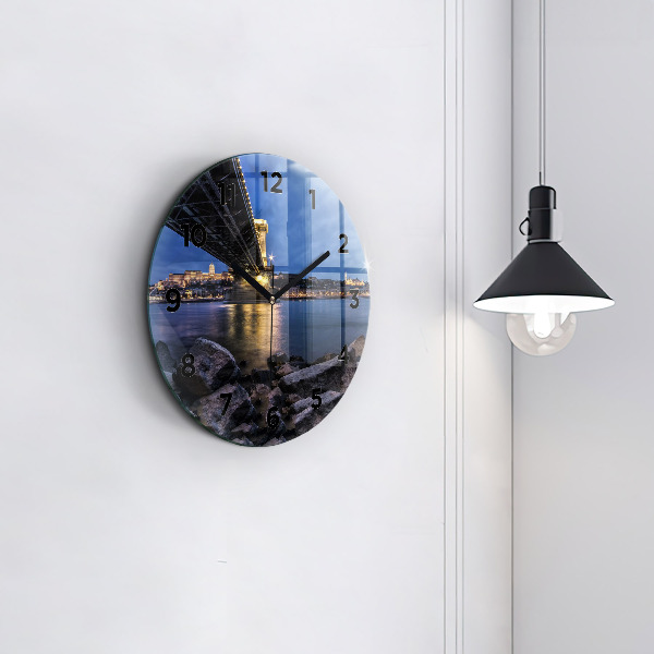 Round glass wall clock Rocky shore under the bridge