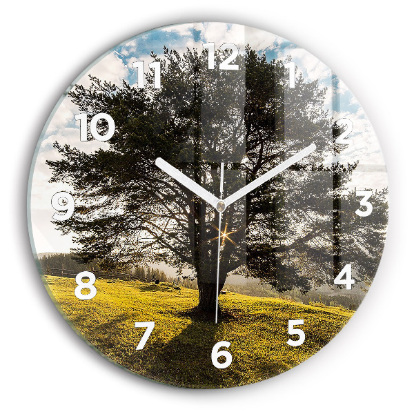 Round glass wall clock A tree on a hill