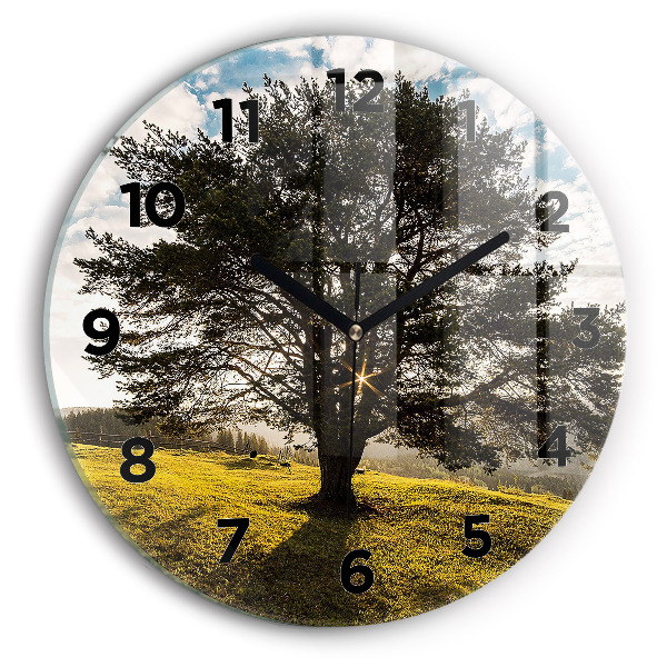 Round glass wall clock A tree on a hill