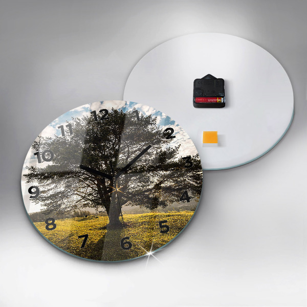 Round glass wall clock A tree on a hill