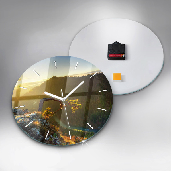 Round glass wall clock Sunset over the mountains