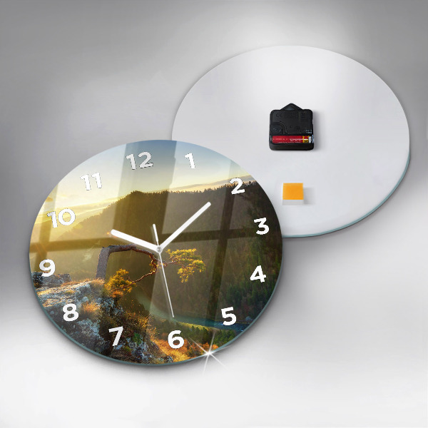 Round glass wall clock Sunset over the mountains