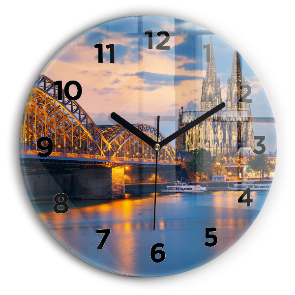 Round glass wall clock View of the town hall