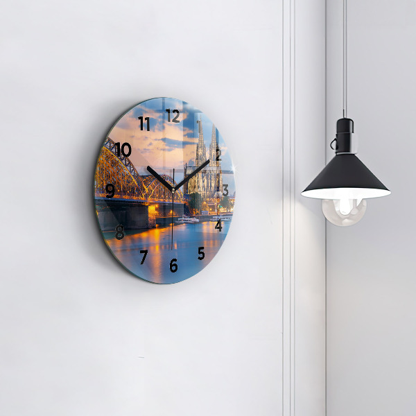 Round glass wall clock View of the town hall