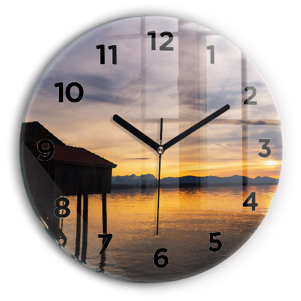 Round glass wall clock Sunset over the lake